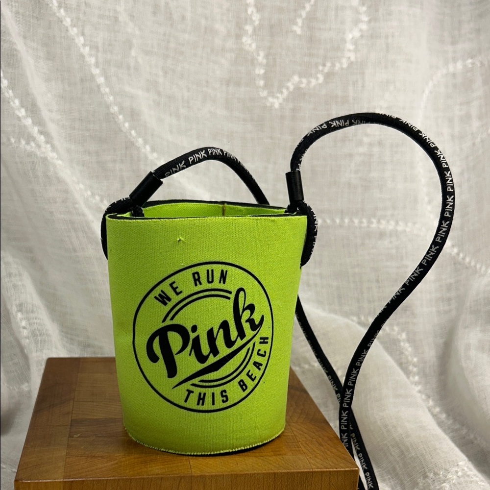 Pink Victoria’s Secret koozie with a strap